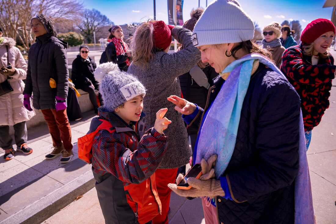 Performers gather outside of the Kennedy Center on Monday to protest executive orders signed by President Trump.