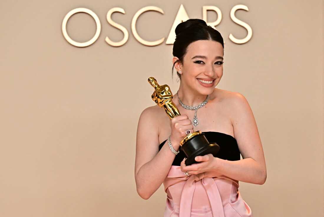 Mikey Madison poses in the press room with the Oscar for best actress in a leading role for Anora.